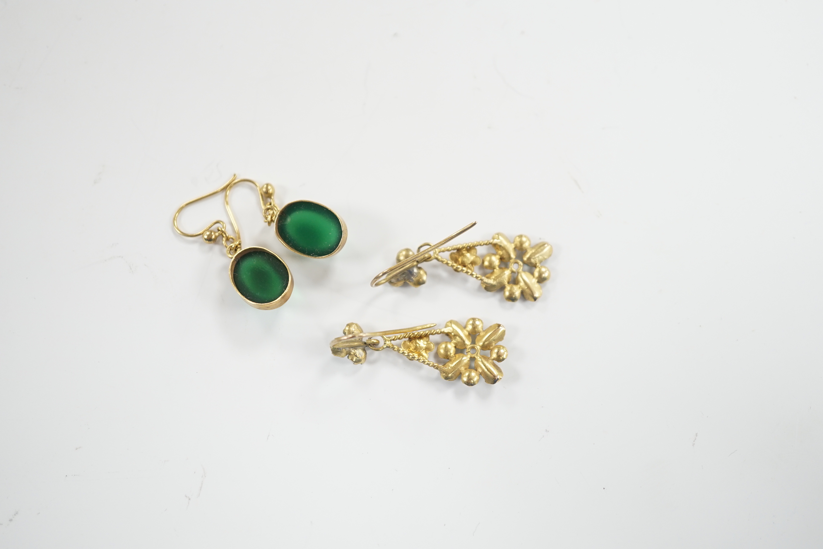 A pair of yellow metal and cabochon chrysoprase set drop earrings and a pair of yellow metal, aquamarine coloured stone and split pearl cluster set drop earrings, gross weight 5.6 grams.